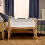 SnüzPod Studio bassinet in Stockholm colour in a bedroom without the wheels
