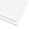 SnuzKot sheets with colorful polka dot pattern on a white background