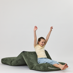 Child sitting on a Forest Rylee Recliner on a white background