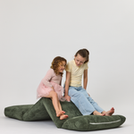 Two children sitting on a Forest Rylee Recliner on a white background