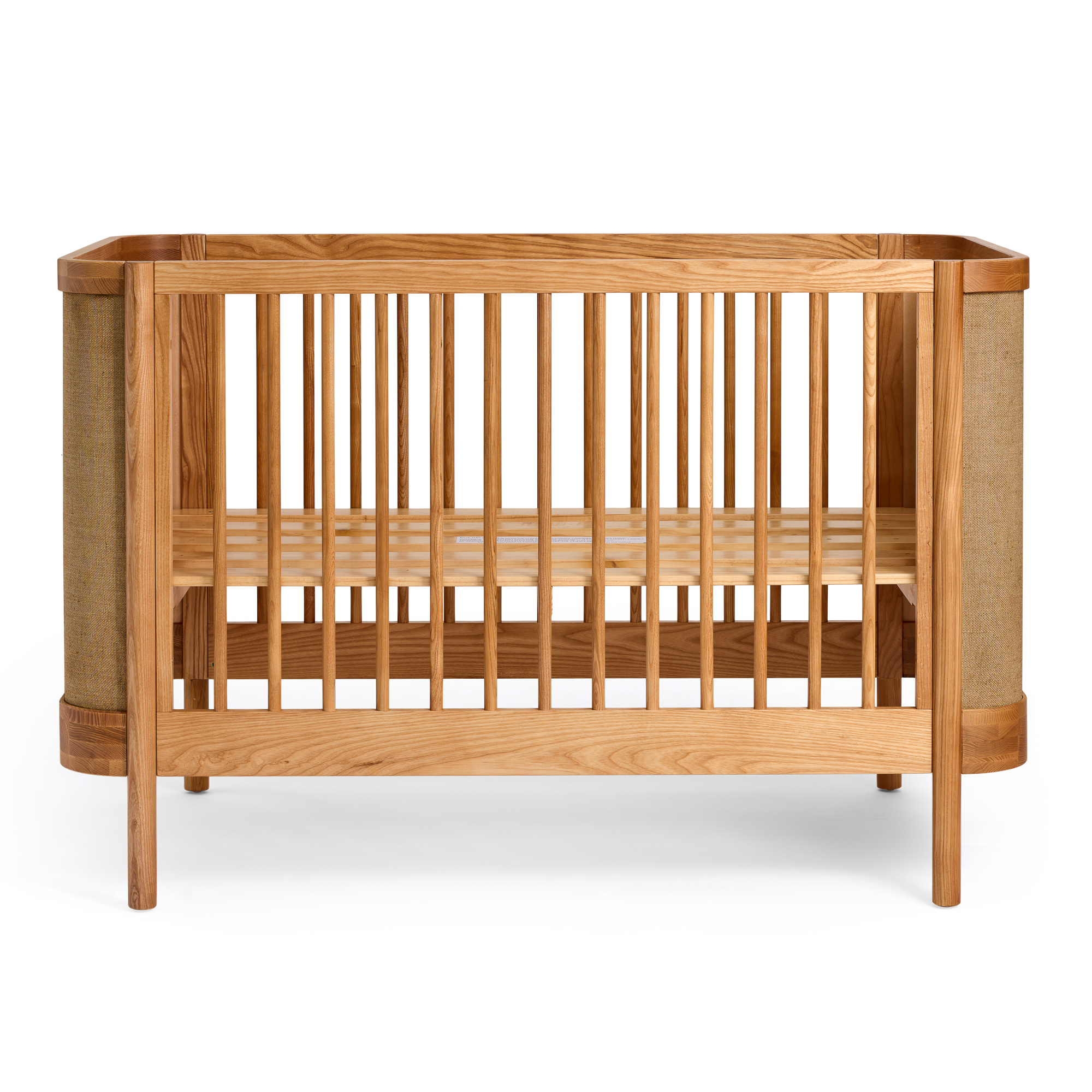 Indi Cot  with woven details on a white background