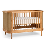 Indi Cot with a white mattress on a white background