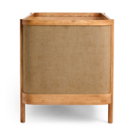 Indi Cot with a textured brown fabric cover on a white background
