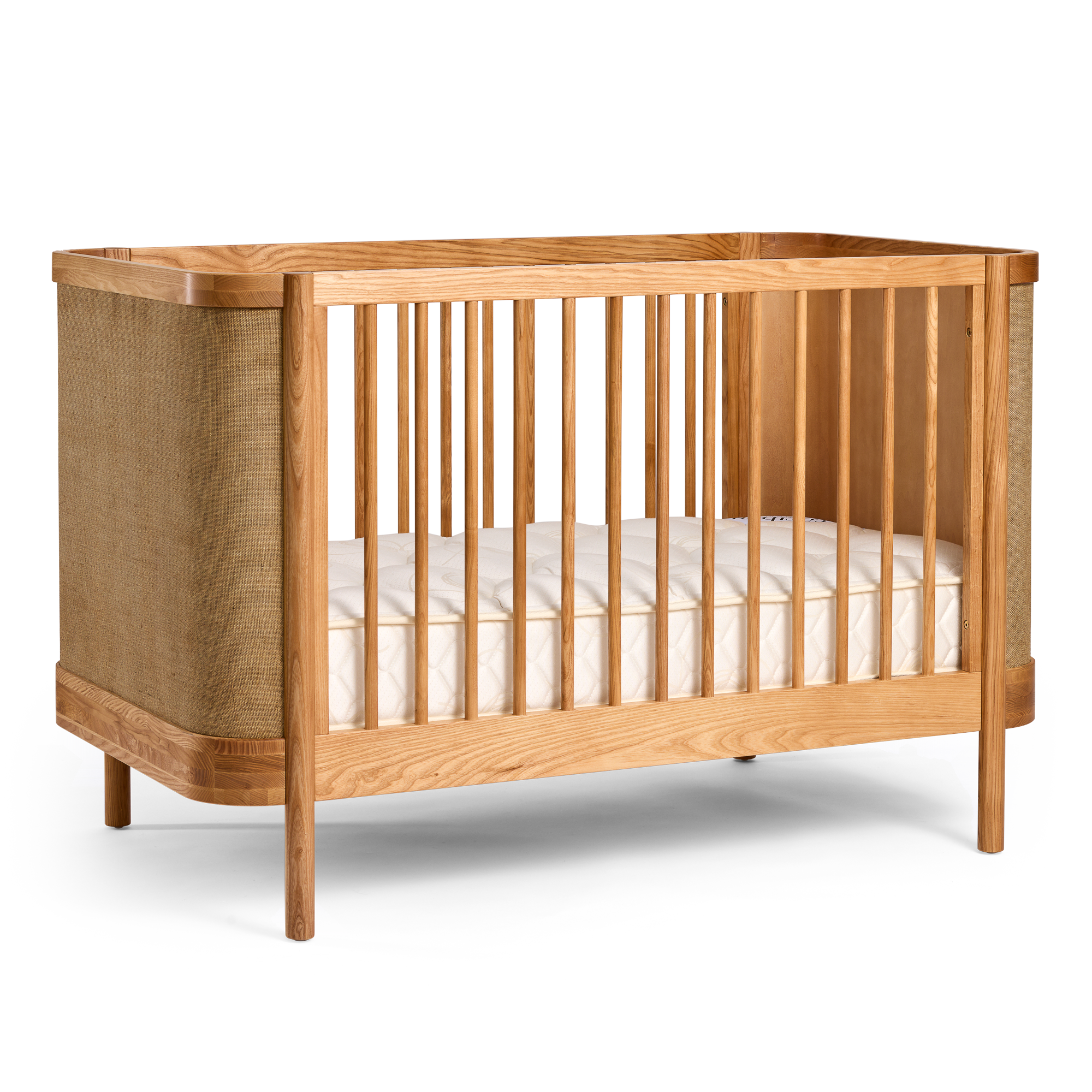 Indi Cot on a side with a white mattress on a white background