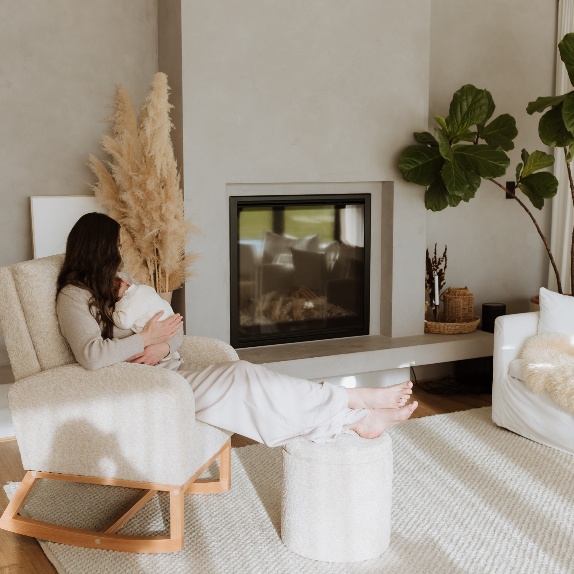 Mother with baby using Myla chair and Mylo ottoman
