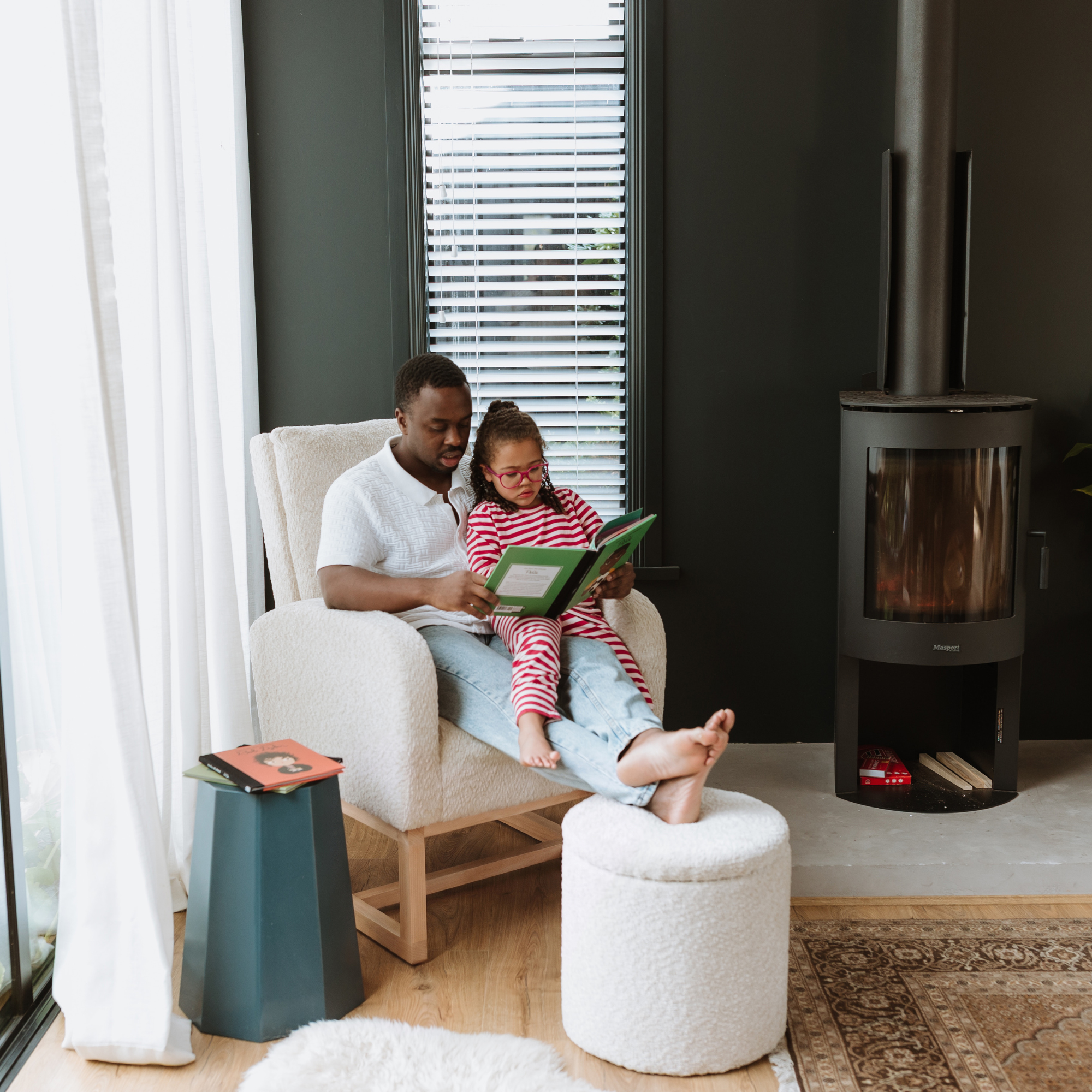 Father and daugher on a Myla chair and Mylo Ottoman