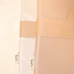 Close-up of a wipeable change pad with 'kiin.' branding on a light background