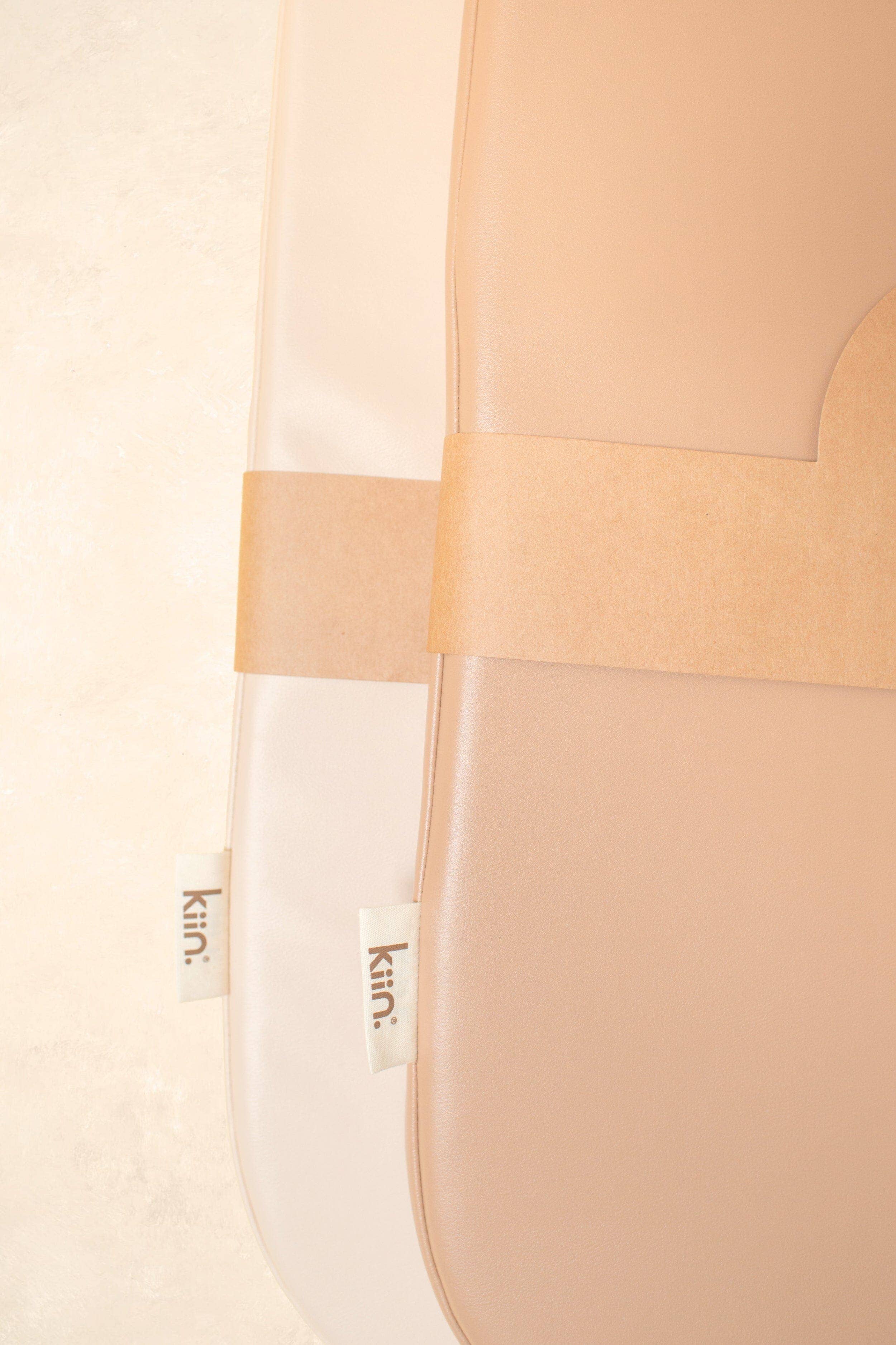 Close-up of a wipeable change pad with 'kiin.' branding on a light background